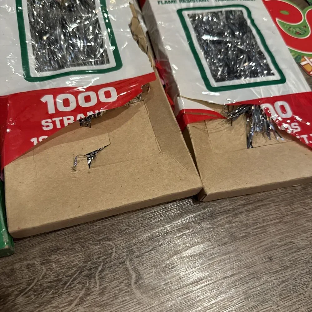 Vintage Lot of 8 Boxes Christmas Tree Icicles Silver Tinsel W/ Christmas Banner